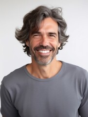 Obraz premium Happy european man in casual clothing against a neutral background