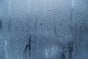 Natural water drops on glass