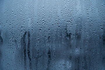 Natural water drops on glass