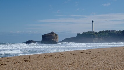 Biarritz beach with La Roche Percée rock and lighthouse in the background
