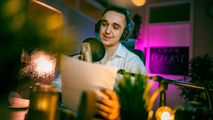 man shooting or streaming video podcast or vlogg blogger at studio