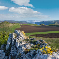 Amazing spring view on the Dnister River Canyon with picturesque rocks, fields, flowers. This place named Shyshkovi Gorby,  Nahoriany, Chernivtsi region, Ukraine.