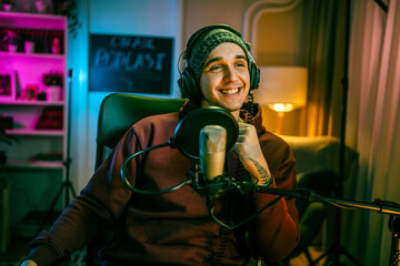 man shooting or streaming video podcast or vlogg blogger at studio