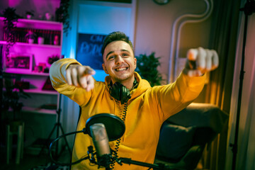 man shooting or streaming video podcast or vlogg blogger at studio