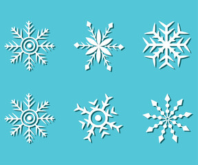 Set of white snowflakes with shadow. Vector on blue background