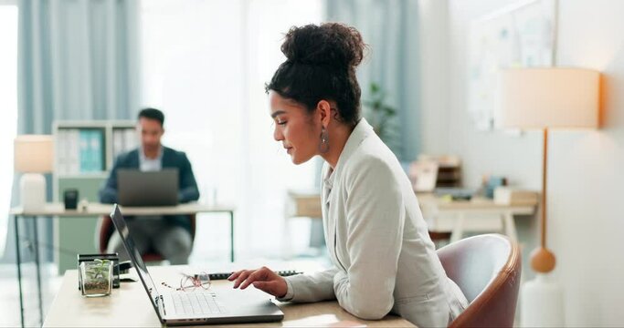 Woman with desk, laptop and typing in coworking space, market research and online schedule at consulting agency. Office, admin business and girl at computer writing email review, feedback or report.