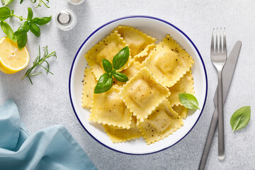 Ravioli with ricotta cheese and fresh basil, top view - 658810242