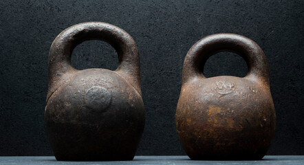 old iron weights on a gray background