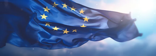 Zelfklevend Fotobehang Flag of European Union waving in the breeze against a sunset sky. Banner with EU flag. © MNStudio