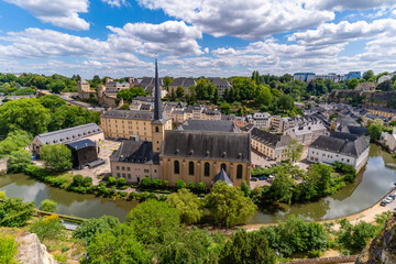 Neumünster Abbey, surrounded by Alzette river, in the Grund district of Luxembourg City - obrazy, fototapety, plakaty