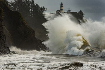 A King Tide wave crashing into the rock infront of the Cape Disappoinment Lighthouse