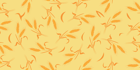 Many wheat spiketels on yellow background. Pattern for design