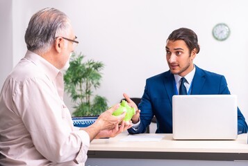 Financial advisor giving retirement advice to old man