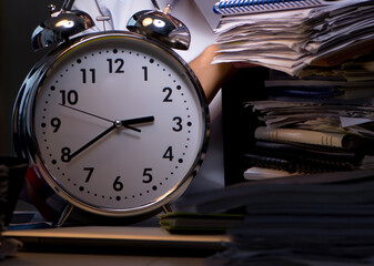 Young businessman working overtime late in office