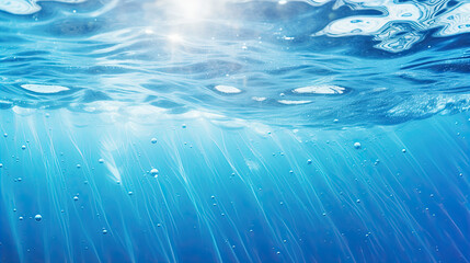 Blurry blue water surface with bubbles and splashes Nature background with sunlight and space for text