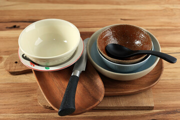 Ceramic Bowl, Wooden Plate, Knife, Spoon, and other Kitchen Equipment