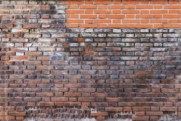 A wall of brown bricks of different ages and large chips. Vector bricks texture background