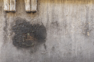 A cement wall with many grease stains and large chips. Vector cement texture background