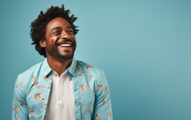 Obraz premium happy handsome fashion African American man smiling and wearing color cloth, solid light color background