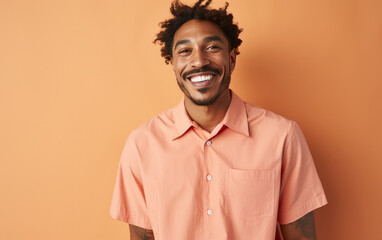 Fototapeta premium happy handsome fashion African American man smiling and wearing color cloth, solid light color background
