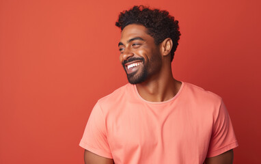 happy handsome fashion African American man smiling and wearing color cloth, solid light color background