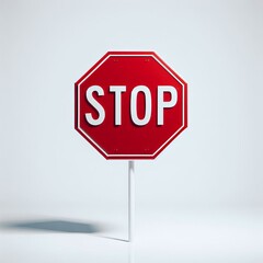 A red stop sign with white letters on a white pole and background.