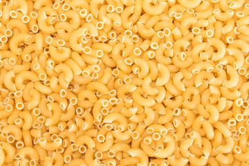 Uncooked Chifferi Rigati Pasta Background. Fat and Unhealthy Food. Classic Dry Macaroni Texture. Italian Culture and Cuisine. Raw Pasta