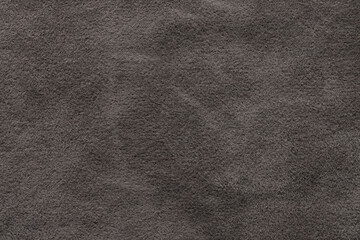 Shaggy background made of gray spotted velor. Close-up texture.