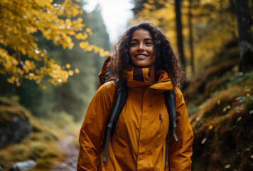 Female hiker hiking in the middle of the forest.