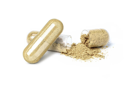 Brown medicine capsule powder isolated on white background.