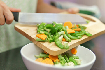 Colorful view of peaces of vegetables on a cutting board