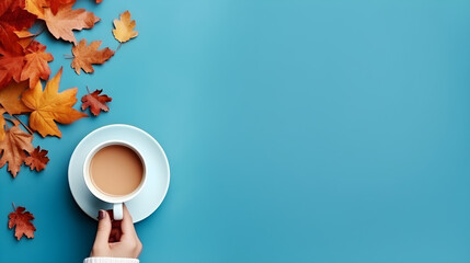 Top view of autumn hot drinks, Relax on Thanksgiving and Halloween holidays. Woman's hand holding...