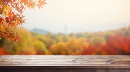 Naklejka na ściany i meble Beautiful bokeh autumn background. Wooden table in front of a colorful autumn landscape, concept with fall leaves and advertising space, A picturesque colorful artistic image with a soft focus.
