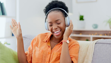 Dance, headphones or happy black woman on sofa for music streaming, mental health or wellness. Energy, couch or fun African person listening to audio technology and singing a hip hop song to relax