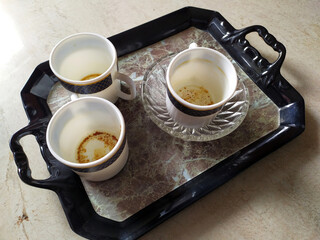 three white empty coffee mug put in a serving tray