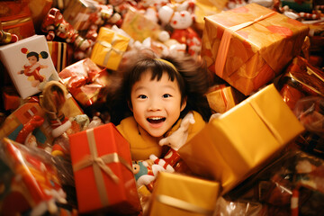 Fototapeta na wymiar Asian young girl covered with pile of Christmas presents