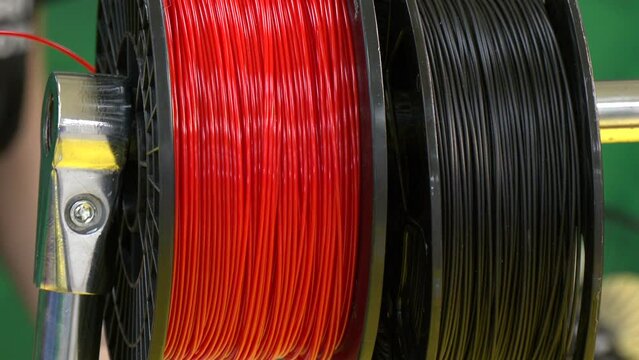 Personal 3d printer and abs or pla filament coils next to him. Plastic Threads on Rolls 3d Printer Filament Reel Holder

