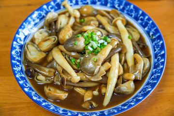 A delicious Chinese home-cooked dish, stir-fried mushrooms with soy sauce