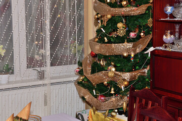 Festively set Christmas table in the home for Christmas dinner in the evening