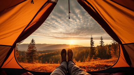 Traveler holding relaxing inside a orange tent