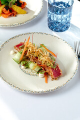 salad with grilled tuna, vegetables sauce and herbs. restaurant