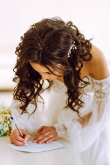 Bride write on registration of Marriage, Woman signing a marriage Contract, close-up
