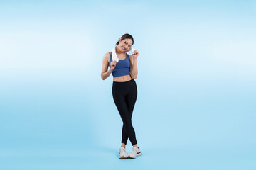 Fototapeta na wymiar Full body asian woman in sportswear portrait, smiling and posing cheerful gesture. Workout training with attractive girl engage in her pursuit of healthy lifestyle. Isolated background Vigorous
