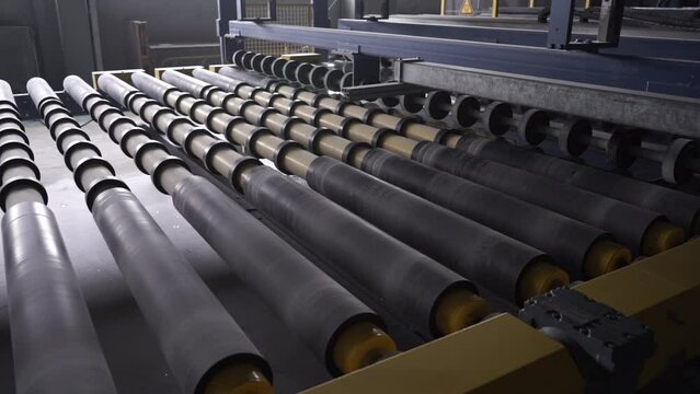 machines working with giant glasses in industrial glass window production factory. Heavy sheet glass. Glass factory. Glass Panels for PVC Windows and Doors Manufacturing, tempered float glass panels
