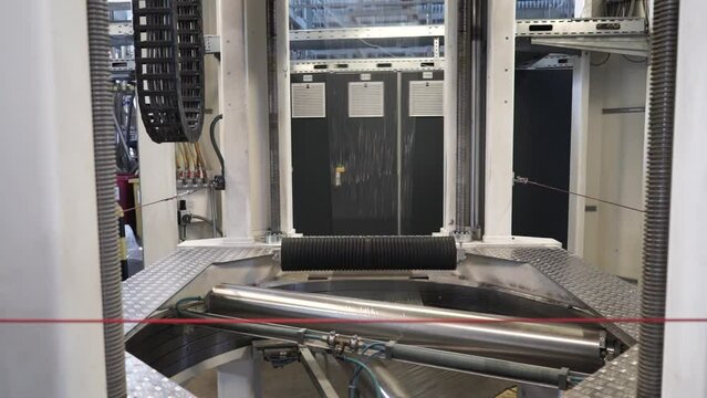 Automatic polyethylene plastic bag production machine with lighting effect.  Industrial line for the production of plastic packaging film. Factory for the production of packaging materials
