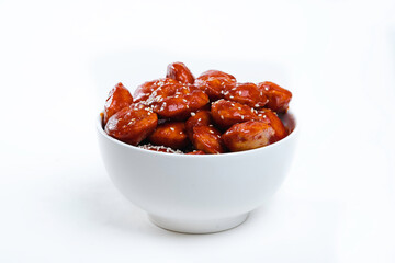 thai chicken in sweet and sour sause in a white bowl. Chinese cuisine