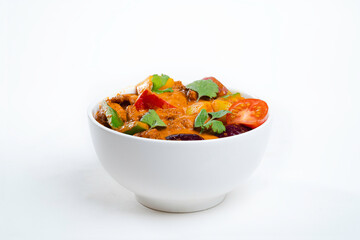hot isolated asian tom yam with tomatoes in a white bowl.Chinese cuisine