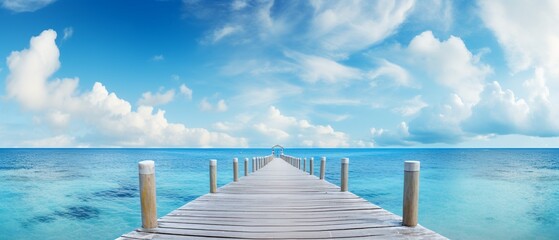 Obraz premium Scenic Bridge to Pier: Ocean and Sky Fusion with Clear Waterscape