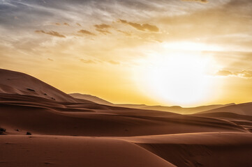 Fototapeta na wymiar Sun shining over sandy desert, Sahara, Morocco