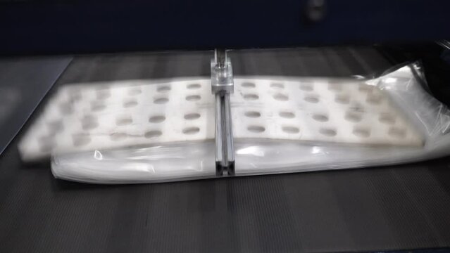 Automatic polyethylene plastic bag production machine with lighting effect.  Industrial line for the production of plastic packaging film. Factory for the production of packaging materials
